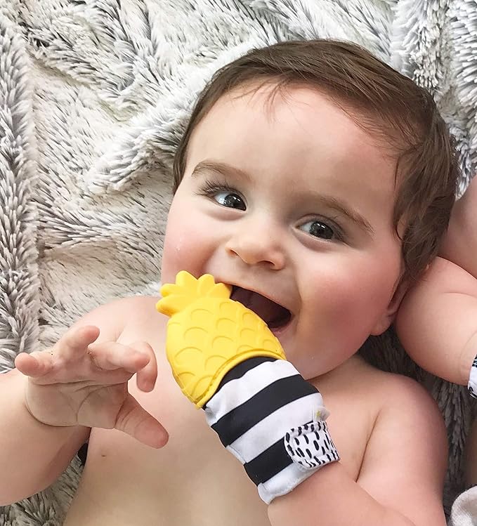 Itzy Ritzy Silicone Teething Mitt - Soothing Infant Teething Mitten with Adjustable Strap, Crinkle Sound & Textured Silicone to Soothe Sore & Swollen Gums 3 Mos