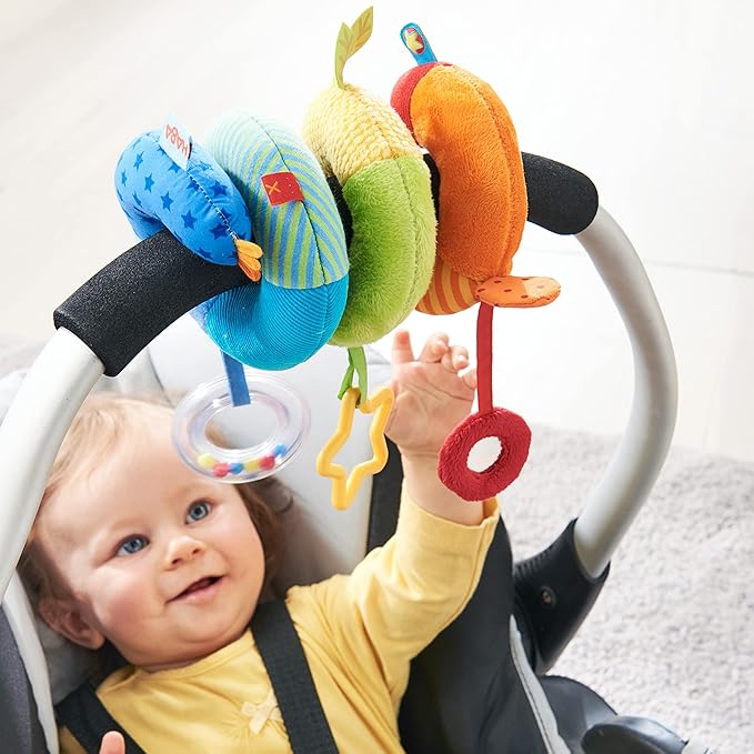 HABA Rainbow Activity Spiral Car Seat Toy and Stroller Toys for Baby 0-6 Months - Colorful Baby Travel Toy with Rattle Teething Element and Sensory Activities