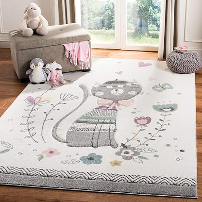 SAFAVIEH Carousel Kids Collection Area Rug - 8' x 10', Ivory & Pink, Cat Design, Non-Shedding & Easy Care, Ideal for High Traffic Areas for Boys & Girls in Playroom, Nursery, Bedroom (CRK187A)