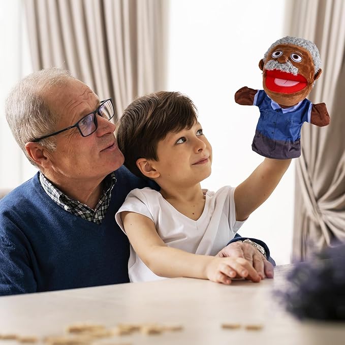 a boy playing with a doll with his grandfather